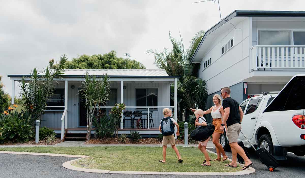 Family holidaying in a Deluxe Tropical Villa at Nobby Beach Holiday Village