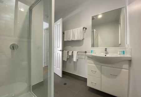 Modern clean bathroom in our new Deluxe Poolside Villas